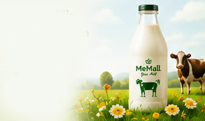 Glass bottle of pure cow milk in a pasture